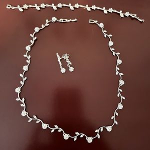 Handmade Rhinestone and silver necklace, matching earrings and bracelet.
